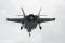 The production F-35 design has a compact axisymmetric convergent/divergent nozzle for the STOVL version and a longer set of nozzle flaps for better performance on the CTOL and CV variants. The two X-35s both flew with the shorter STOVL nozzle flaps on the PW 611 engine to reduce cost and schedule span on the prototype program.
