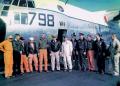 The US Navy aircrew assigned to the KC-130 carrier landing trials--Lt. Jim Flatley, Lt. Cmdr. W. W. "Smokey" Stovall; ADR-1 Ed Brennan and ADR-1 Al Sieve (likely in the orange flight suits)--meet with the Forrestal's captain and members of his staff at the end of the test program in November 1963.