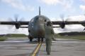 16 July 2010: Three engines running, one ready to start. A Royal Air Force loadmaster signals to the flight crew onboard the aircraft to start engine number one. The RAF sent two C-130Js to RAF Kinloss for the Combined Strength 2010 exercise. The RAF has two C-130J units, XXIV and 30 Squadrons, both based at RAF Lyneham.