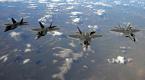 F-22 Raptors from Elmendorf Air Force Base, Alaska, fly over Alaska.