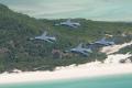 Four RAAF F-111s from Amberley fly over Queensland's Whitsunday Islands.