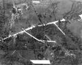 This photo, taken by a U-2 Dragon Lady high altitude reconnaissance pilot on 19 October 1962, the sixth day of the Cuban Missile Crisis, shows the rapid buildup of Soviet missiles and troops on the island. The image shows two Soviet SS-4 intermediate-range ballistic missile erectors and seven camouflaged missile trailers as well as two tent camps and a motor pool near San Cristobal. Photos such as this helped US national leaders understand the scope of Soviet troop presence near missile sites and also provided an understanding of how quickly the missiles were being readied for use.