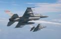 Aerial photo of two F-16s from North Dakota carrying Sparrow missiles. The Guard stopped flying the Air Defense version of the F-16 in 2007.  Fargo, North Dakota, was the last Guard unit to operate the ADF version of the F-16 in the  United States.