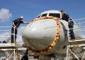 Sailors assigned to Patrol Squadron 47 (VP-47) carefully place a flower lei on the nose of a P-3C Orion at MCB Kaneohe Bay, Hawaii, in 2004. This is the first VP-47 aircraft to return home after a six-month deployment supporting operations in the 5th fleet Area of Responsibility.