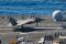 <p>US Navy test pilot Cmdr. Tony Wilson made the first arrested landing of the F-35C Lightning II on an aircraft carrier on 3 November 2014. Wilson landed F-35C test aircraft CF-03 at 12:18 p.m. local time aboard the USS Nimitz (CVN-68) underway at sea in the Pacific Ocean. He caught the number-three arresting wire. The arrested landing is part of initial at-sea Developmental Testing I (DT-1) for the F-35C, which expected to last two weeks. During DT-1, the F-35 Lightning II Integrated Test Force at NAS Patuxent River, Maryland, has scheduled test pilots flying test aircraft CF-3 and CF-5 to perform a variety of operational maneuvers, including catapult takeoffs.DT-1 will also include general maintenance and fit tests for the aircraft and support equipment, as well as simulated maintenance operations. </p>