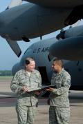 SMSgt. David Dunn (left) and MSgt. Abel Alverez (right), both the from the 19th Aircraft Maintenance Squadron's Green Dragon flight, review the maintenance log for 61-2358 prior to the aircraft's retirement ceremony and final flight on 1 May 2012.