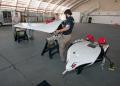 The X-56 test team set up in the same hangar at Edwards AFB, California, which was used to prep the XP-59, America’s first jet aircraft, in 1942. Two types of wings will be tested on the X-56—a stiff set and a flexible set. The stiff set of wings (shown here) is designed in the traditional manner with beefed up structure to avoid having flutter within the flight envelope.