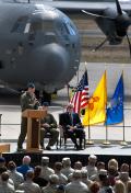 US Air Force Maj. Gen. Mark Solo, commander of 19th Air Force, speaks before the assembled crowd during ceremonies marking the first delivery of the HC-130J Combat King II personnel recovery aircraft to the 58th Special Operations Wing at Kirtland AFB, N.M., on 29 September 2011. US Senator Jeff Bingaman (D-New Mexico) is seated at right.