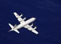 A P-3C Orion aircraft from Patrol Squadron VP-40 flies a mission during GUAMEX 2014. GUAMEX is a multilateral exercise intended to enhance the interoperability and to strengthen personnel ties between the US Navy, Japan Maritime Self-Defense Force, Royal Australian Air Force, and Royal New Zealand Air Force.