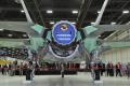 The Pratt & Whitney F135 engine will power the first series of  F-35Bs. The F136, an interchangeable engine under development by the GE  Rolls-Royce Fighter Engine Team, will make its first F-35 flight in  2010. Rolls-Royce produces the shaft-driven lift fan, three-bearing  swivel nozzle, and roll duct systems.