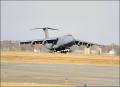 The first C-5M assigned to Dover AFB, Delaware, touches down during the delivery ceremony.